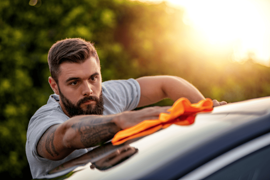 man washing car as a summer side hustle