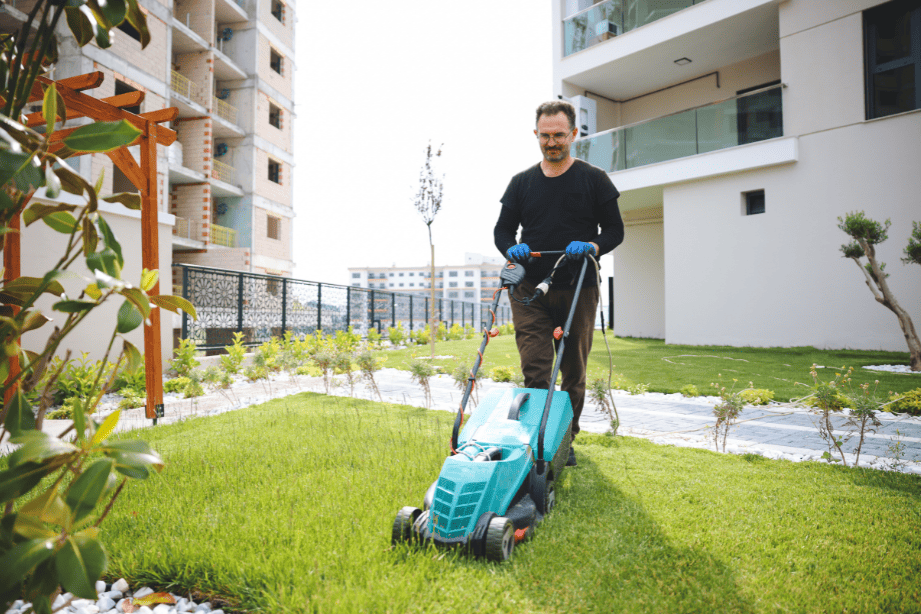 man mowing lawn as a summer side hustle