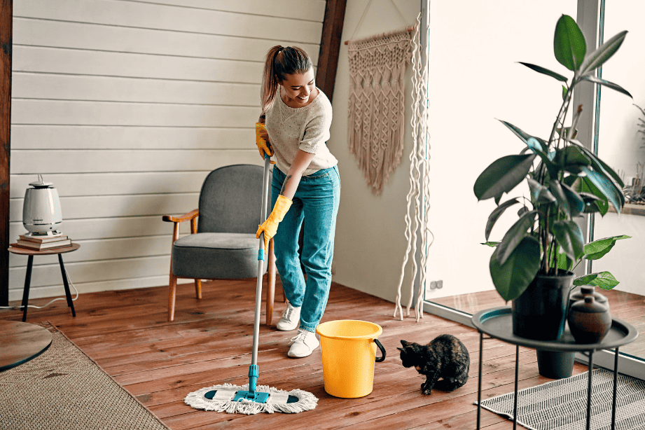 woman cleaning house as a summer side hustle